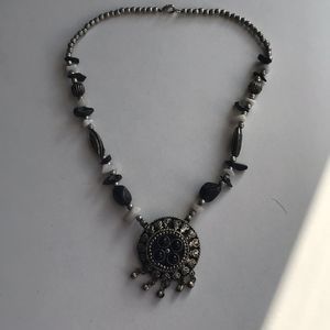 Necklace with black and white stones.